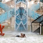 People cool off at Atlantis Ancol waterpark on a hot