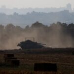 A Israeli tank manoeuvres near the Israel-Gaza border