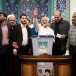 Presidential candidate Saeed Jalili votes at a polling station in