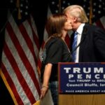 FILE PHOTO: Root is greeted with a kiss from Trump