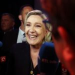 Marine Le Pen reacts after first round results of the