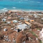 Damaged houses missing roofs after Hurricane Beryl passed Grenada