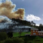 Smokes billows from a blaze near the village of Setienes
