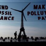 Activists turn Eiffel Tower into giant wind turbine to welcome