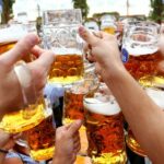 FILE PHOTO: Visitors toast with beer