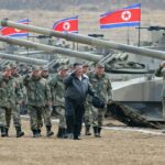 North Korean leader Kim Jong Un guides a military demonstration