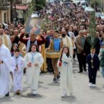 Lebanese Christian worshippers take part in a Palm Sunday procession