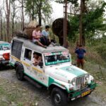 Vehicles carrying election materials move through Buxa Tiger Reserve forest