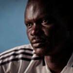 The Wider Image: African migrant disaster survivor haunted by weeks