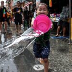 Revellers celebrate the New Year Water Festival in Bangkok