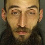 Cody Balmer appears in a booking photograph after his arrest