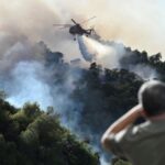 FILE PHOTO: Wildfire burns near the village of Helidori, near