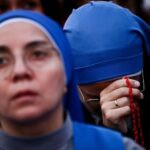 The Wider Image: Thousands line up to pay respect to