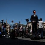 The Wider Image: Thousands line up to pay respect to