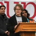 FILE PHOTO: Demonstrators rally on Cambridge Common in a protest
