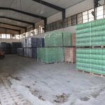 A forklift operator works at a warehouse in Sarmada