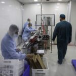 Workers supervise the manufacturing of medicines inside Reva Pharma factory