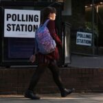 A student walks past a polling station in Rickmansworth