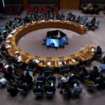 FILE PHOTO: People attend a Security Council meeting at the