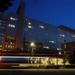 Vehicles pass in front of the World Bank building, which