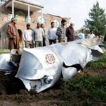 Metal debris lies on the ground in Wuyan