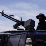 FILE PHOTO: Syrian security forces deployed in the village of