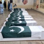 Men gather to attend funeral prayers of people who were