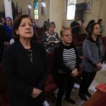 FILE PHOTO: Palestinian Christians attend a Mass at the Holy
