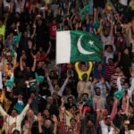 Pakistani spectators cheer during a hugely anticipated final of its