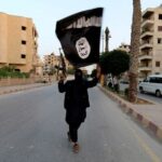 FILE PHOTO: A member loyal to the Islamic State in