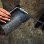 Dilawar Singh shows a part of the drone which crashed