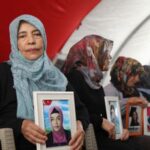 Hatice Levent holds a picture of her daughter Fadime who