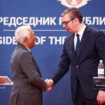 European Council President Antonio Costa shakes hands with Serbian President