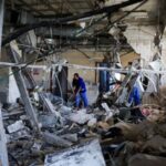 A person inspects Nasser Hospital a part of which was