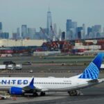 FILE PHOTO: A plane docks on the tarmac at Newark