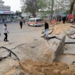 Palestinians inspect the damage at the European Hospital, in Khan