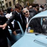 FILE PHOTO: Jose Mujica gets into his Volkswagen Beetle after