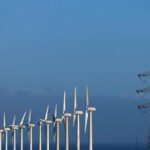 FILE PHOTO: High-voltage power lines and an electricity pylon next