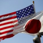 FILE PHOTO: Japan and U.S. flags fly outside the White