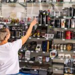A woman looks in a shop with merchandise from the