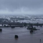A drone view shows a flooded area following heavy rains,
