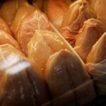 Chicken is displayed in a fridge in a market in