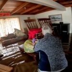 Australia woman rescued from floods by helicopter