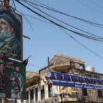 A view show a sign depicting late Hezbollah leader Hassan