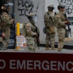 California National Guard troops stand outside the Edward R. Roybal