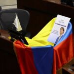 A flag and a card lie on the seat of