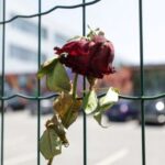 FILE PHOTO: Flowers and candles are seen in front of