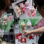 People look at Labubu dolls at the flagship store of