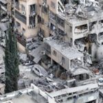 A drone photo shows the damage over residential homes and