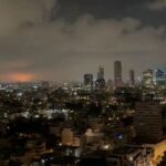 A rocket explosion lights up the sky in Tel Aviv